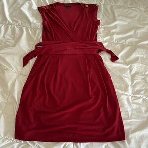 Sleeveless red waist tie mini dress with gold shoulder buttons